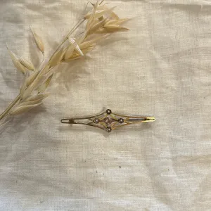Antique 9 ct. yellow gold pink sapphire and seed pearl bar pin
