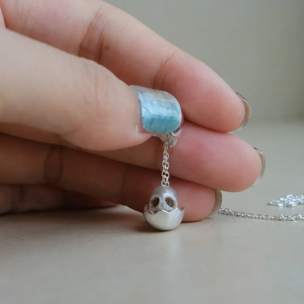Eggshell Broken Pearl Skull Silver Pendant Necklace