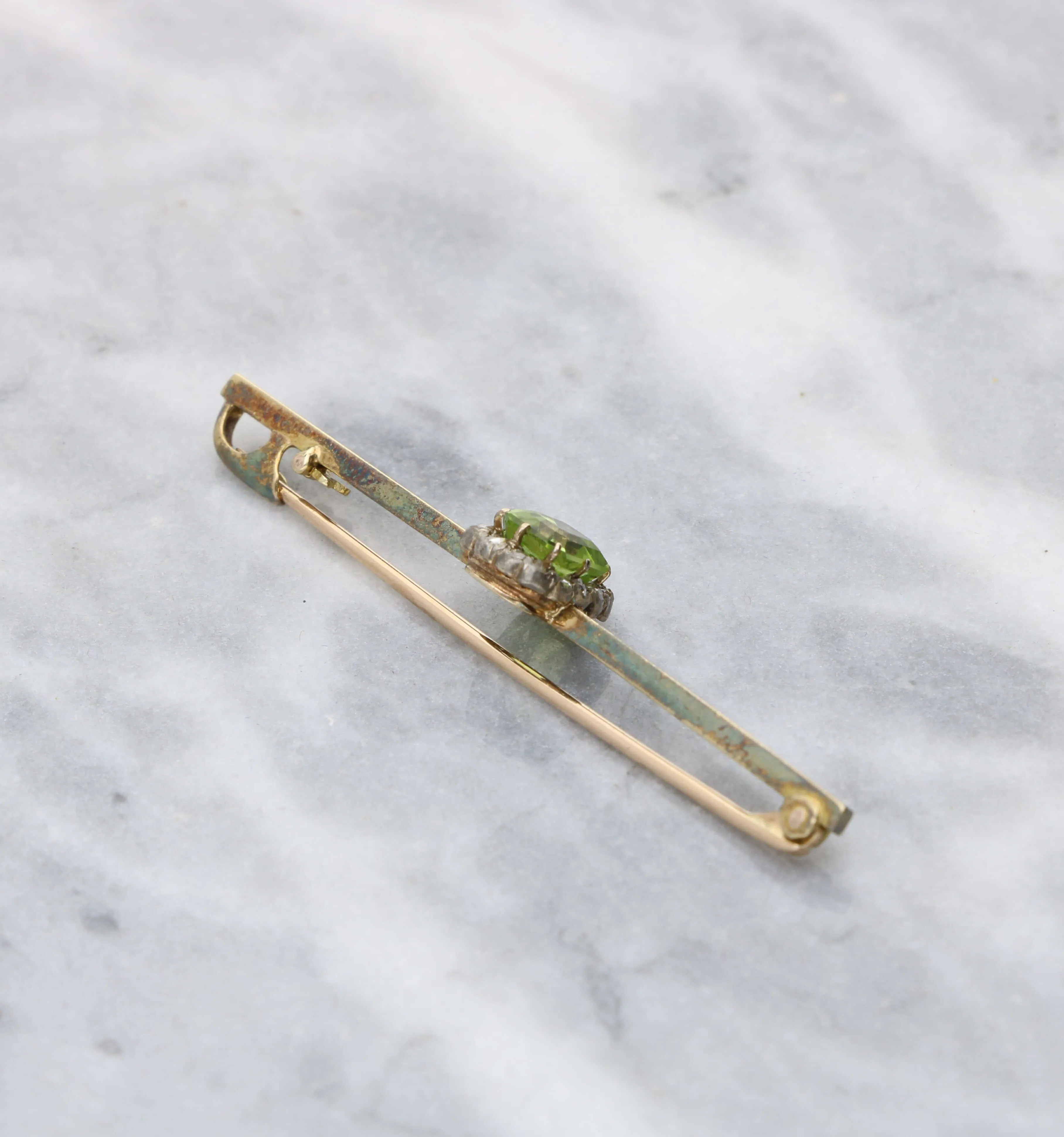 Peridot and rose-cut diamond brooch
