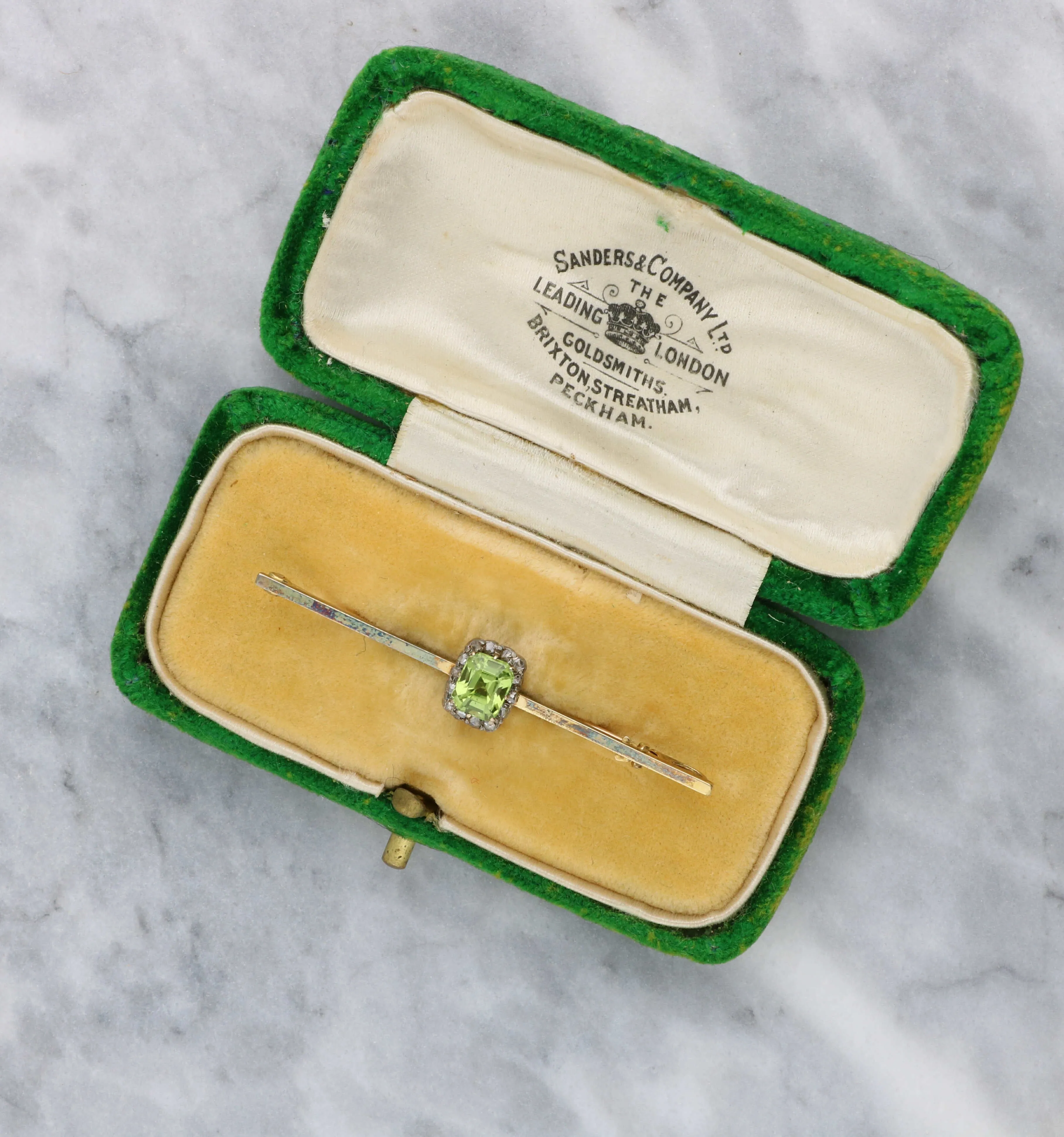 Peridot and rose-cut diamond brooch