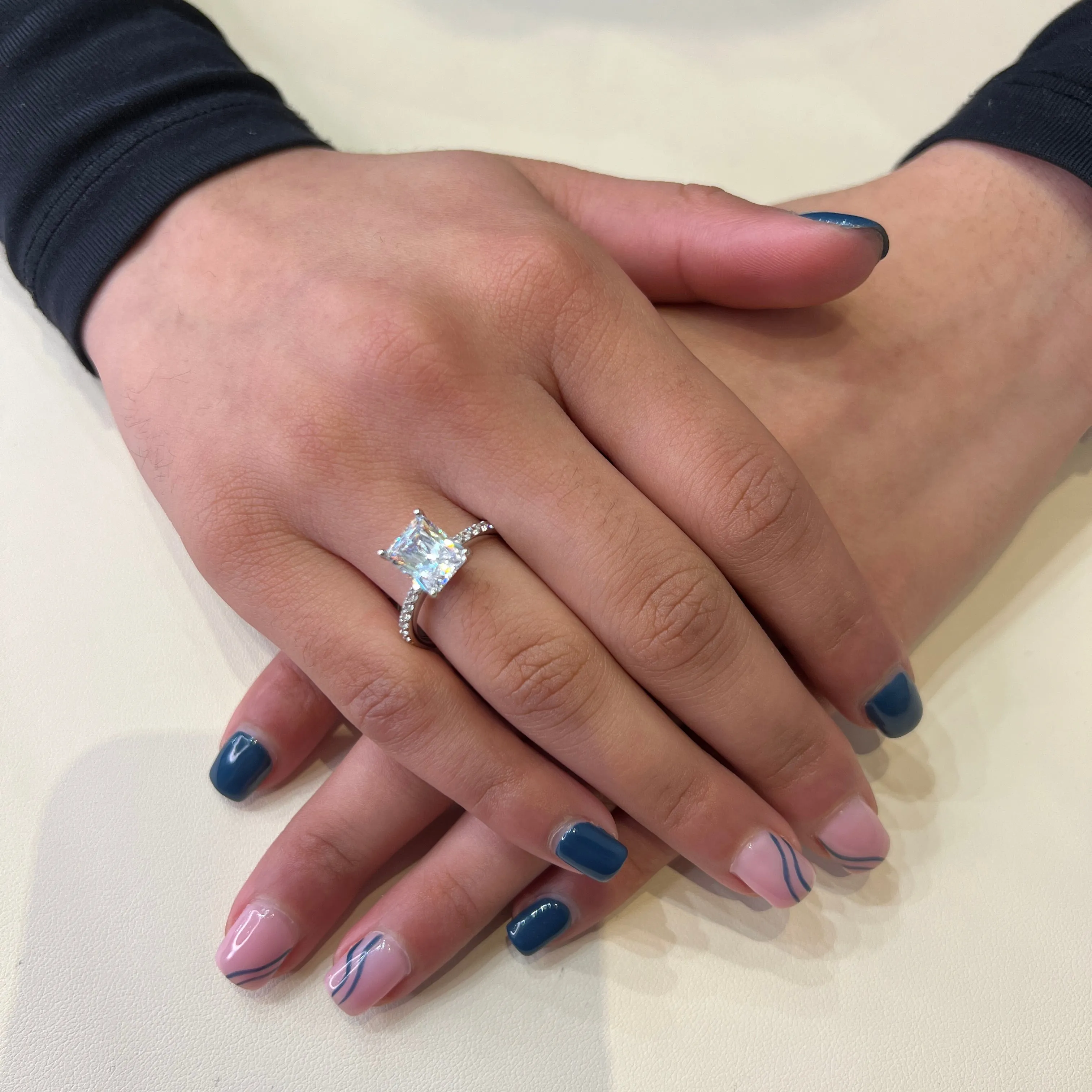 Reign Sterling Silver Rhodium Plated CZ Emerald Cut Ring
